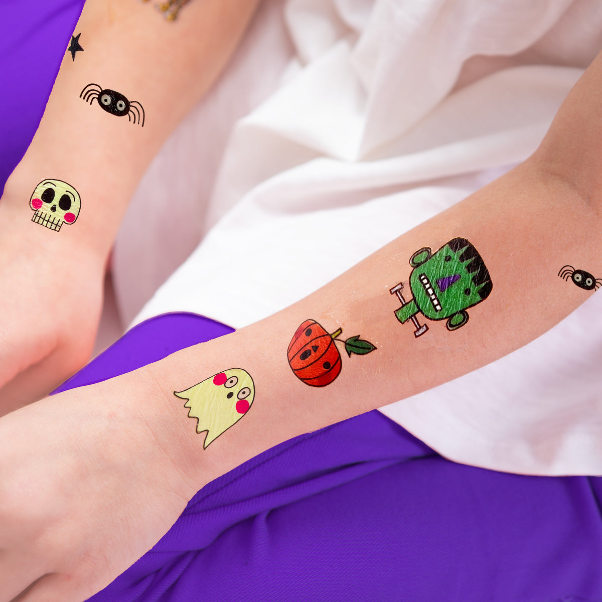 Child wearing spooky Halloween glow in the dark temporary tattoos