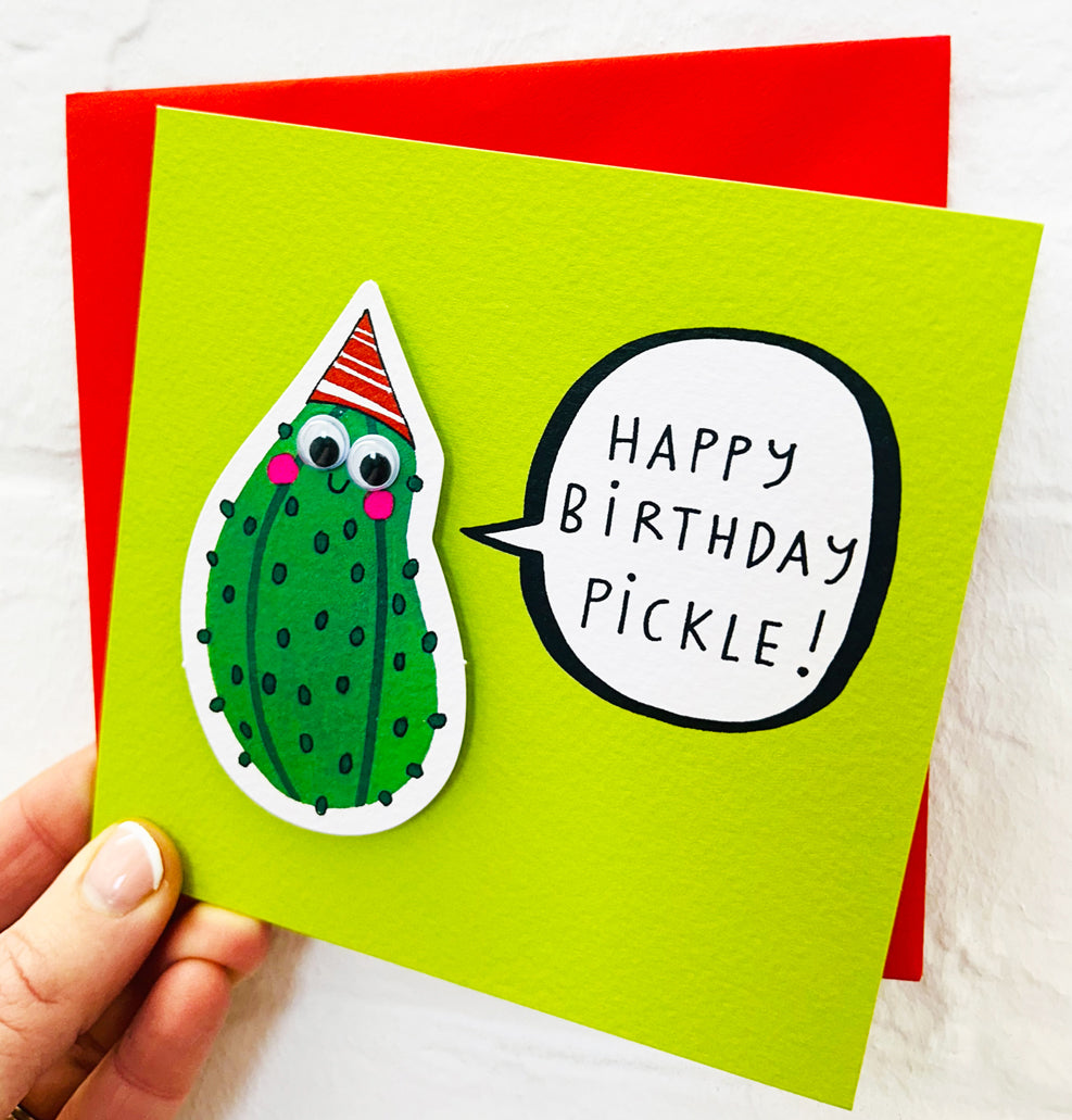 Birthday card with a pickle with google eyes and a party hat illustration and &