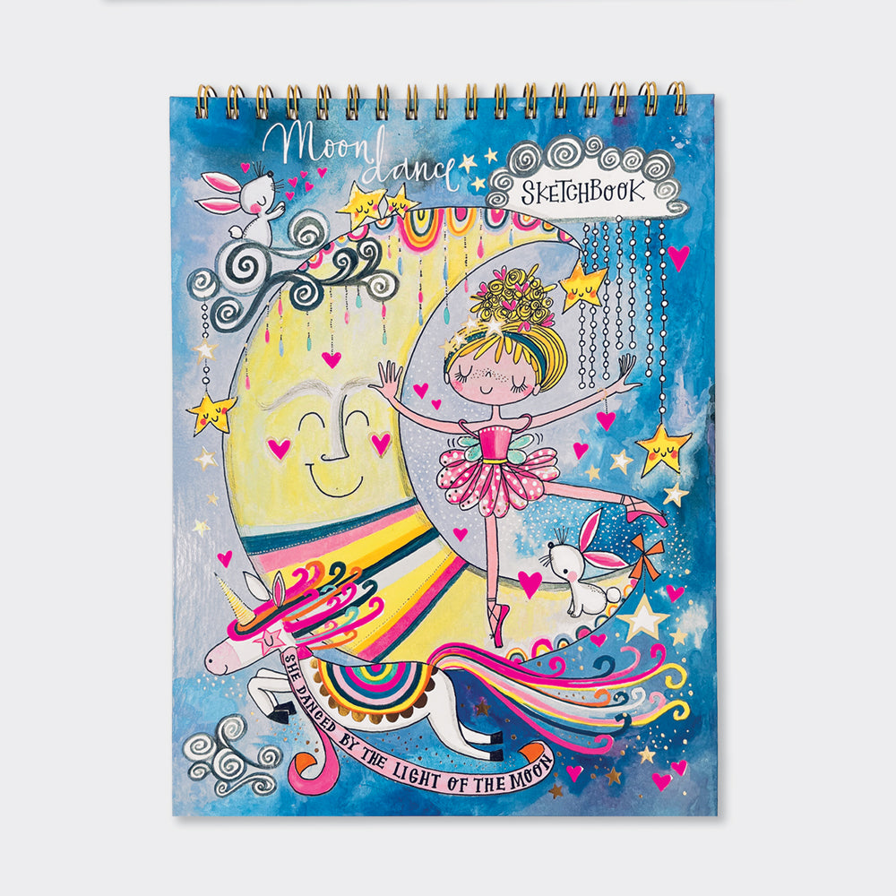 A colorful sketchbook with a whimsical design featuring a ballerina, moon, stars, and the text &