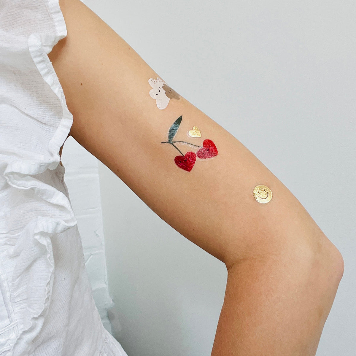 Tattoo of cherries on a person&