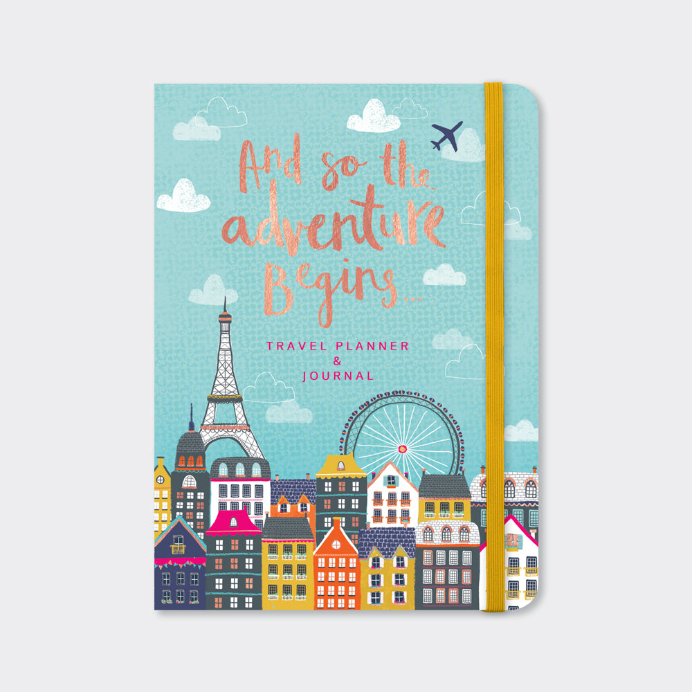 Travel planner and journal with rose gold foil cover and illustrated cityscape