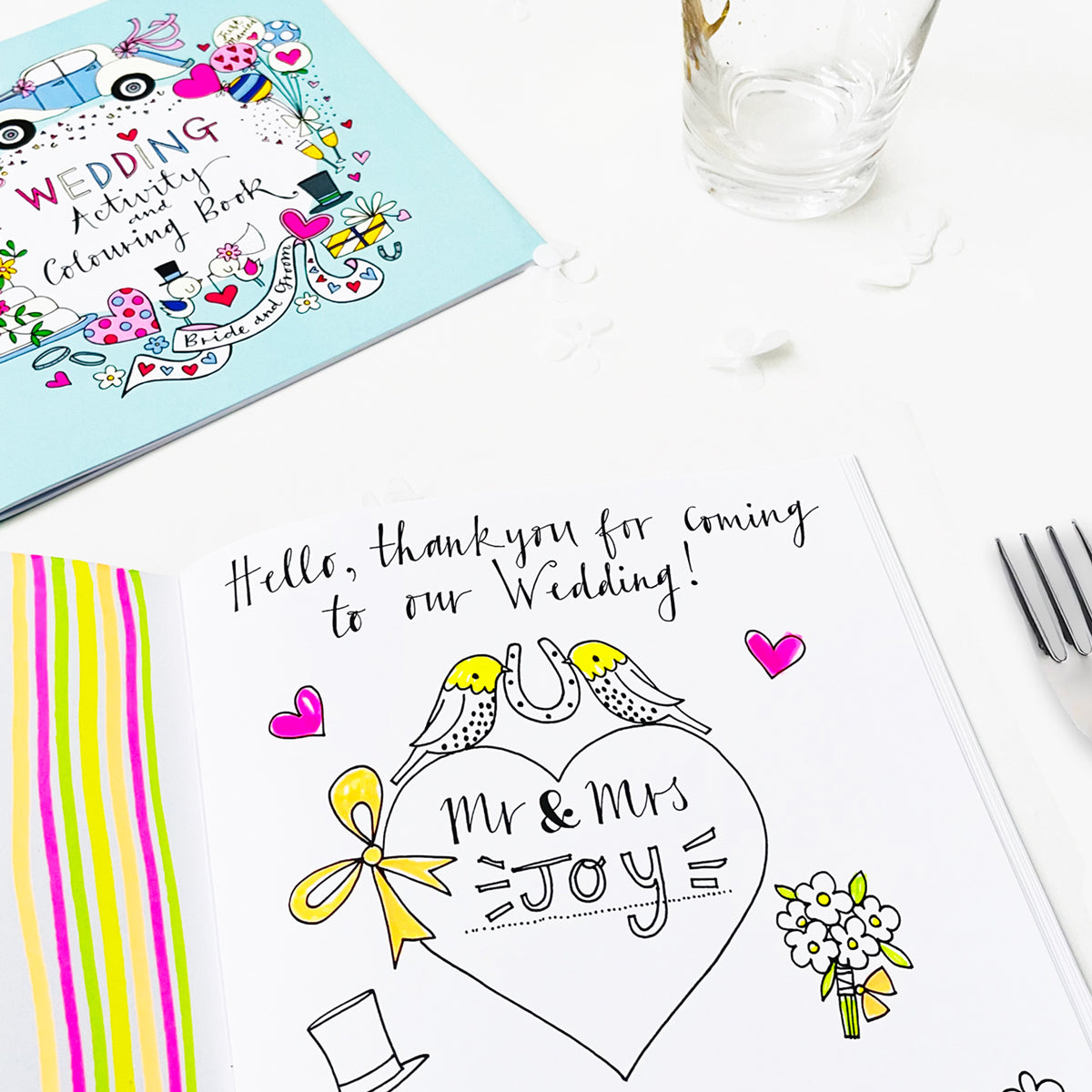 Inside page of wedding activity book showing colouring activities for young guests
